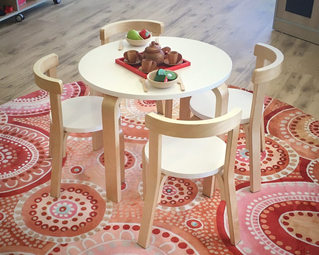 Wooden tea set on a play table